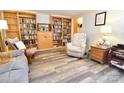 Cozy living room features built-in bookshelves, comfortable seating, and wood-look flooring for a relaxed atmosphere at 105 Venus Ave, Gastonia, NC 28052