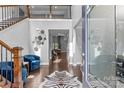 Inviting two-story foyer with hardwood floors, staircase, and stylish accents providing a warm welcome at 11209 Flenniken Ct, Charlotte, NC 28277