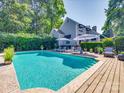 Inviting pool area with lounge chairs and umbrellas perfect for outdoor relaxation at 15 Old Stage Trl, Clover, SC 29710