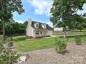 Beautiful house with a chimney, front porch, attached garage, and a well-manicured lawn at 1505 Wimbleton Woods Dr # 5, Fort Mill, SC 29708