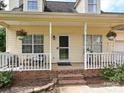 Inviting front porch, perfect for relaxing, with charming details and ample seating space at 1505 Wimbleton Woods Dr # 5, Fort Mill, SC 29708