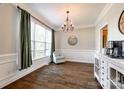 Inviting dining area with hardwood floors, accent chair, and modern lighting at 1648 Jonesberry Dr, Rock Hill, SC 29732