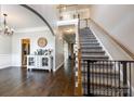 Inviting entryway with hardwood floors, staircase, and decorative furnishings leading to the upper level at 1648 Jonesberry Dr, Rock Hill, SC 29732