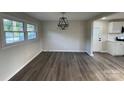 Bright dining area with new flooring, modern lighting, and a large window offering pleasant views at 1735 Hollandale Dr, Gastonia, NC 28054