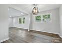 Inviting dining area featuring a modern light fixture, fresh paint, and plenty of natural light at 1735 Hollandale Dr, Gastonia, NC 28054