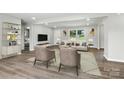 Bright living room with hardwood floors, neutral decor, and a comfortable seating arrangement at 1735 Hollandale Dr, Gastonia, NC 28054