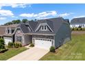 Charming house with stone accents, two car garage and landscaped front lawn at 19004 Dry Narrows Way, Charlotte, NC 28278