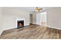 Bright living room showcasing vinyl plank floors, a fireplace, and white trim at 2009 Auten Rd, Gastonia, NC 28054