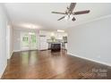 Open floor plan features hardwood floors and a bright kitchen with stainless appliances at 205 E Cleveland Ave, Bessemer City, NC 28016