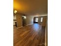 Spacious living room boasts wood flooring and natural light at 2106 S Main St, Kannapolis, NC 28081