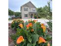 Lovely two-story home with vibrant flowerbeds and landscaped front yard, adding curb appeal at 212 Old Centergrove Rd, Kannapolis, NC 28083