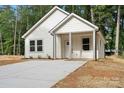 Charming single-story home with white siding and a cozy front porch at 217 E Division Ave, Salisbury, NC 28144