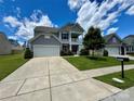 Beautiful home with a two-car garage, well-manicured lawn, and a classic design at 2311 Verde Creek Rd, Charlotte, NC 28214