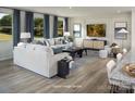 Bright, open living room featuring hardwood floors, neutral tones, and elegant furniture at 2533 Mabel Ln, Monroe, NC 28110