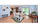 Cozy dining room features hardwood floors, light blue walls and access to the screened porch at 3017 Brooks Mill Ln # 10, Wingate, NC 28174