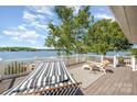 Lake views abound from this deck with outdoor seating, hammock and white railing overlooking the water at 4586 Doctor Dr, Catawba, NC 28609