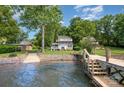 Lake house boasts a private dock and waterfront access with mature trees adding beauty to this property at 4586 Doctor Dr, Catawba, NC 28609