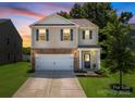 Charming two-story home with a well-manicured lawn and inviting front entrance at 461 Misty Law Ln, Clover, SC 29710