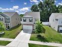 Home with a driveway, 2-car garage, and green lawn at 461 Misty Law Ln, Clover, SC 29710