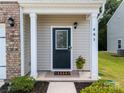 Inviting front entrance featuring a decorative glass door, manicured landscaping, and house number at 461 Misty Law Ln, Clover, SC 29710
