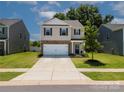 A well-maintained two-story home with a brick-accented garage and a clean, inviting front yard at 461 Misty Law Ln, Clover, SC 29710