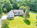 Beautiful home with a well-manicured lawn, inviting front entrance, and mature shade tree at 511 Brookwood Dr, Statesville, NC 28677
