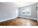 Inviting room with beautiful hardwood floors and ample natural light with views of the neighborhood at 524 Hawthorne Ln, Charlotte, NC 28204