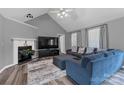 Cozy living room with a fireplace, vaulted ceiling, and comfortable seating at 532 Jedburgh Way, Rock Hill, SC 29730