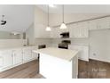 Bright kitchen featuring white cabinetry, an island, and stainless steel appliances at 737 Lynville Ln, Rock Hill, SC 29730
