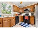 Functional kitchen featuring wooden cabinets and modern appliances at 8007 Red Lantern Rd, Indian Trail, NC 28079