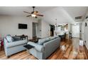 Open living space with hardwood floors flowing into dining area at 9623 Duxford Ln, Charlotte, NC 28269