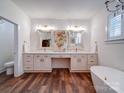 Spacious bathroom featuring dual vanities, a soaking tub, and stylish fixtures at 0000 Trull Hinson Rd # 2, Wingate, NC 28174