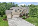Charming brick home boasts a well-manicured lawn, lush landscaping, and a spacious three-car garage at 10620 Euclid Nw Ave, Concord, NC 28027