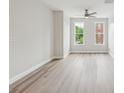 Bright bedroom featuring hardwood floors, with large windows that offers ample natural light at 1126 Dean Hall Ln, Matthews, NC 28105