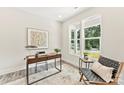 Bright home office with a modern desk, comfortable chair, and large windows offering natural light at 1645 Carolina Cir, Gastonia, NC 28054