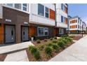 Well-maintained townhome exterior with landscaped garden and inviting entrance at 2108 Bryant Park Dr, Charlotte, NC 28208