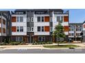 Modern townhome showcasing a contemporary design with mixed material facade at 2108 Bryant Park Dr, Charlotte, NC 28208