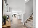 Bright foyer with light wood floors, staircase, and views of the living area at 3064 Ora Smith Rd, Lincolnton, NC 28092