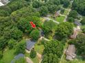 Aerial view of a property nestled among lush trees, showcasing its peaceful and private setting at 3120 7Th Street Ne Dr, Hickory, NC 28601
