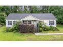 Inviting single-story home with a classic design and a neatly landscaped front yard at 321 Woodcrest Dr, York, SC 29745