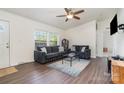 Comfortable living room features modern furniture, a ceiling fan, and ample natural light at 321 Woodcrest Dr, York, SC 29745