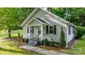 Gray house with black shutters and a short walkway to the front door and front yard at 352 18Th Ne Ave, Hickory, NC 28601