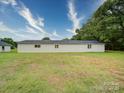 Simple outbuilding with a clean white exterior, offering versatile space on the property at 4115 Jenkins Rd, Marshville, NC 28103