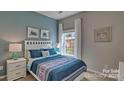 Inviting bedroom featuring a cozy bed, soft lighting, and a calming color scheme at 4607 Harris Elliot Rd, Lincolnton, NC 28092