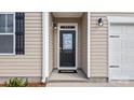 Close up of the home's entry door with stylish accents and a modern design at 4607 Harris Elliot Rd, Lincolnton, NC 28092