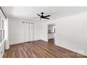 Spacious living room with recessed panel walls, wood floors and an open floor plan at 5323 Flat Creek Rd, Heath Springs, SC 29058