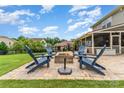 Inviting backyard patio with comfortable seating around a brick fire pit at 755 Lagan Ct, Fort Mill, SC 29715