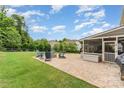 Relaxing backyard with a cozy fire pit and brick patio, perfect for entertaining at 755 Lagan Ct, Fort Mill, SC 29715