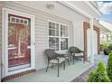 Inviting front porch with seating area, perfect for relaxing and enjoying the outdoors at 8108 Christmas Ct, Charlotte, NC 28216