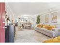 Bright living room with stylish decor, seamlessly flowing into the dining area and kitchen at 8108 Christmas Ct, Charlotte, NC 28216